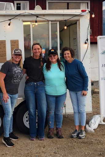 Four volunteers at the food truck