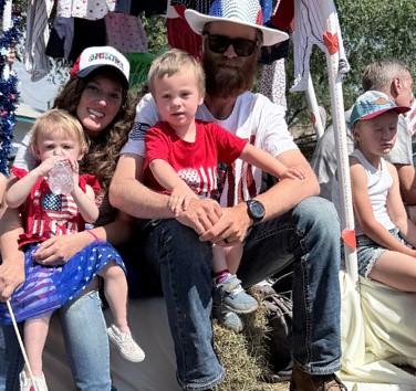 A family on the float in red, white and blue